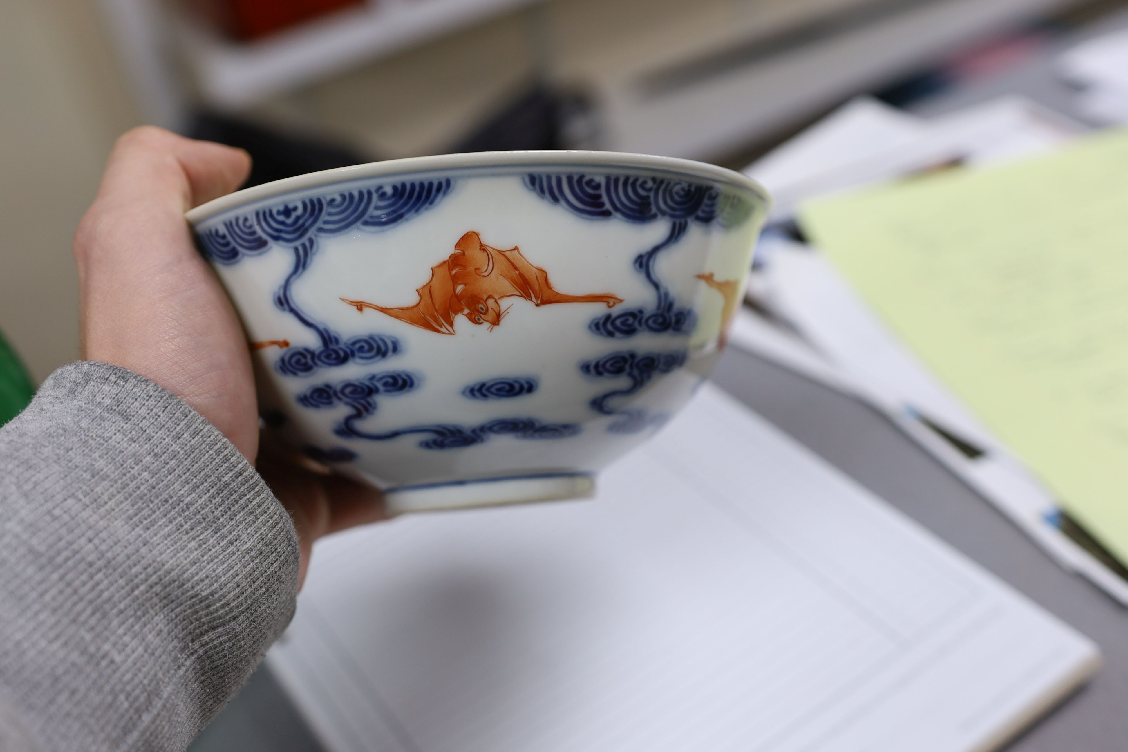 A pair of Chinese iron red and underglaze blue ‘five bat’ bowls, Guangxu mark and probably of the period (1875-1908), 16.5cm diameter